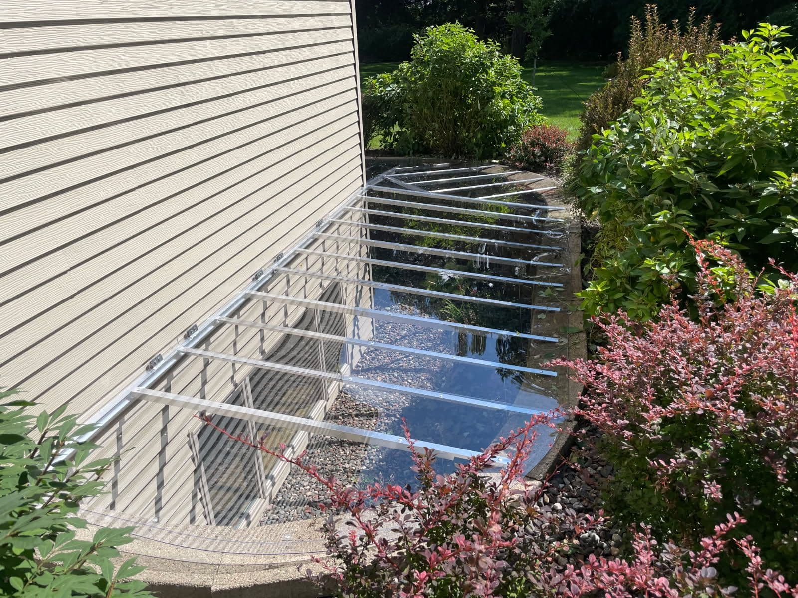 Project Enhanced Natural Light with Lean-To Style Window Well Covers image