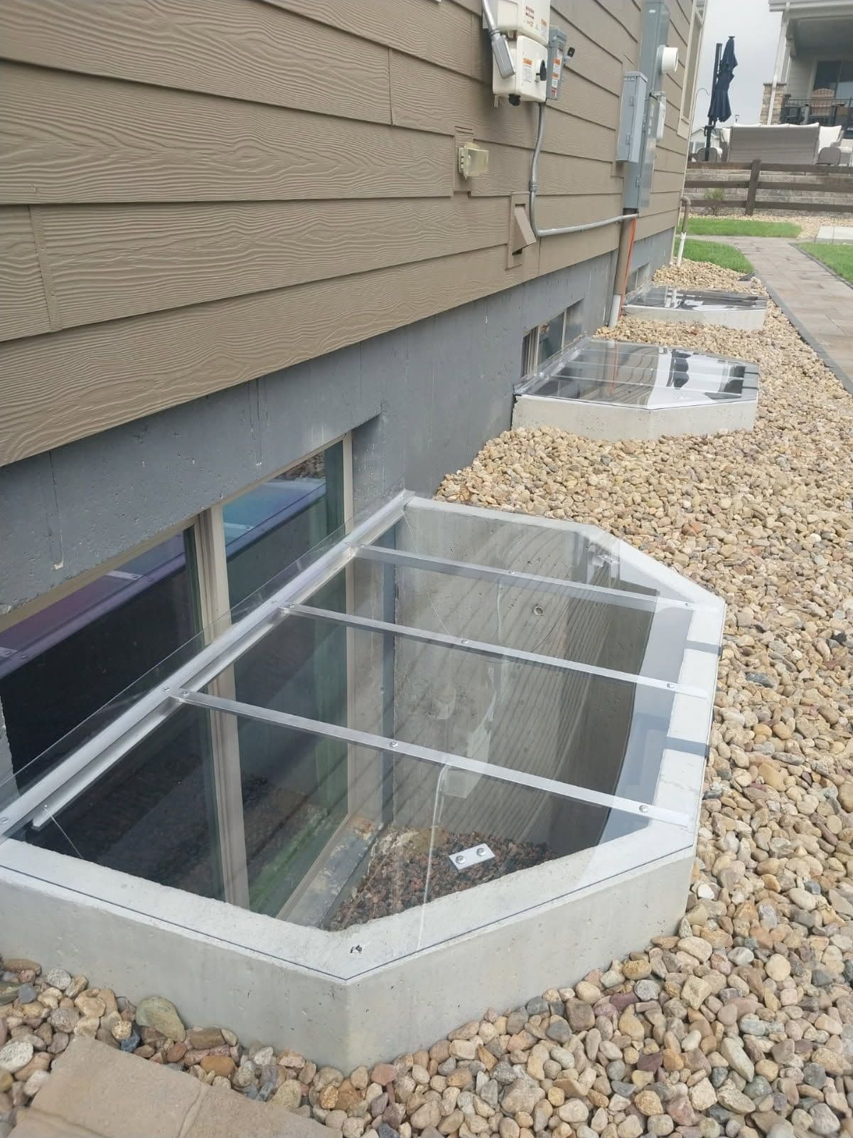 Sleek Low Profile Window Well Covers for Basement Protection image